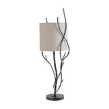 Libra Interiors Branch Iron Twig table lamp in black with hand-forged twisting stems, round weighted base and cylindrical linen shade on a white background.