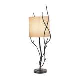 Libra Interiors Branch Iron Twig table lamp in black with hand-forged twisting branch stems, round base and cylindrical linen shade, on a white background.