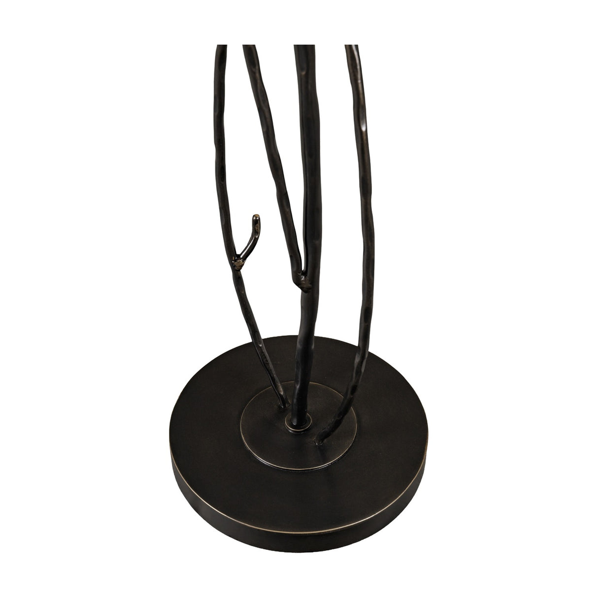 Close-up of the Libra Interiors Branch Iron Blackened Floor Lamp base, showing hand-forged iron branch stems rising from a round blackened metal foot.