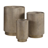 Libra Interiors Corrugated Iron Ridged Floor Planter set of three in rustic champagne gold, cylindrical ridged bodies on recessed bases, plain background.