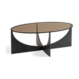 Libra Interiors Bronze Glass Sculptural Coffee Table in black, with an oval smoked glass top and intersecting curved iron base on a white background.
