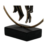 Close-up of the Libra Interiors Rough Cast Four Figure Circle Family Sculpture showing dangling legs, antique gold ring and matt black resin base.