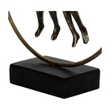 Close-up of Libra Interiors Antique Gold Circle Seated Couple Sculpture base, showing the figures' slender legs, brushed metallic ring and solid black plinth.