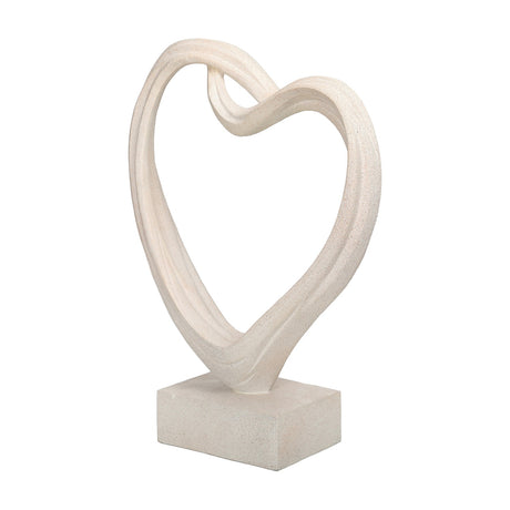 Libra Interiors Grainy Resin Abstract Heart Sculpture in white with a twisted open silhouette on a square base, shown against a plain white background.