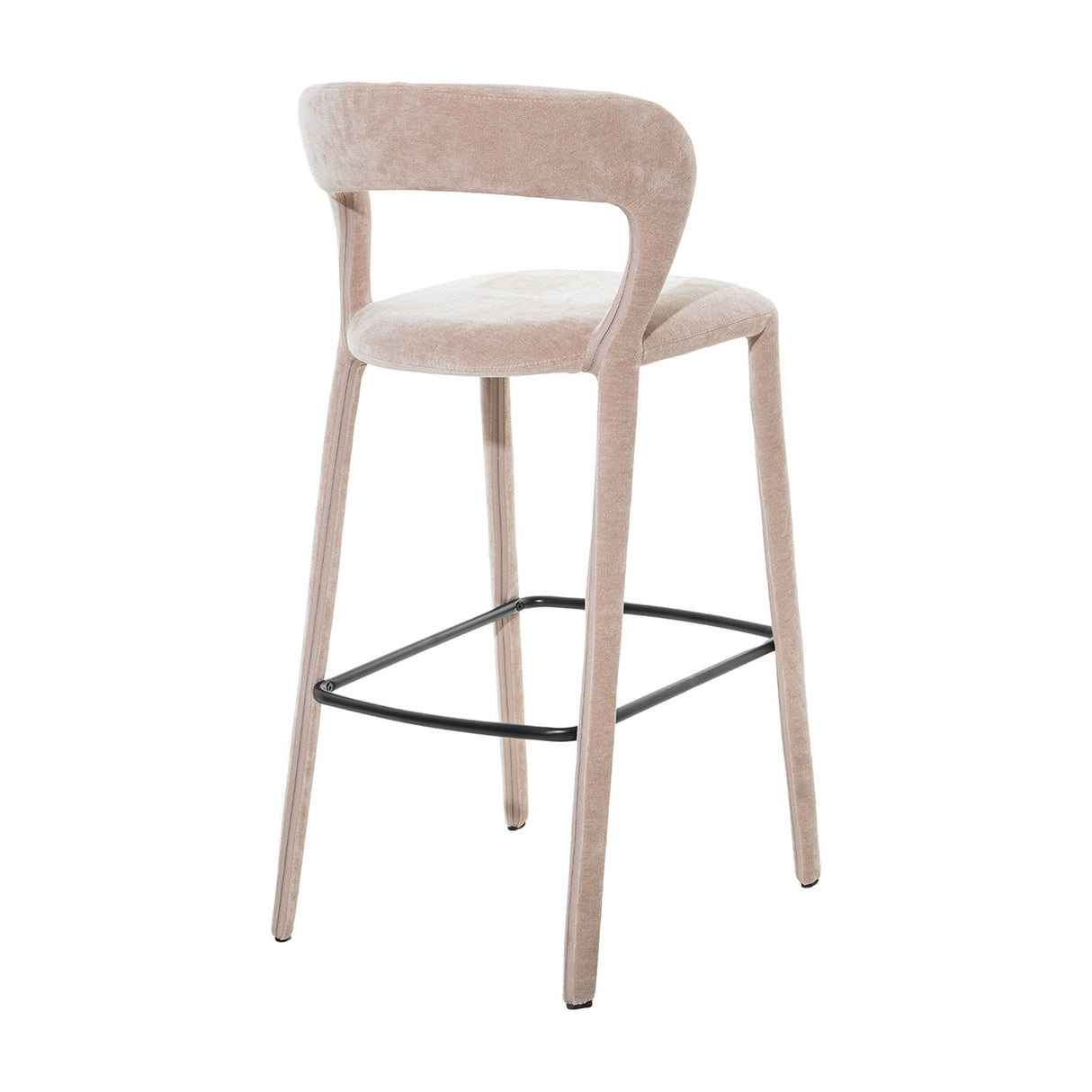 Libra Interiors Velvet Wrapped Curved Back Bar Stool in taupe, with sculptural curved back, rounded seat, fabric-covered tapered legs and black metal footrest.