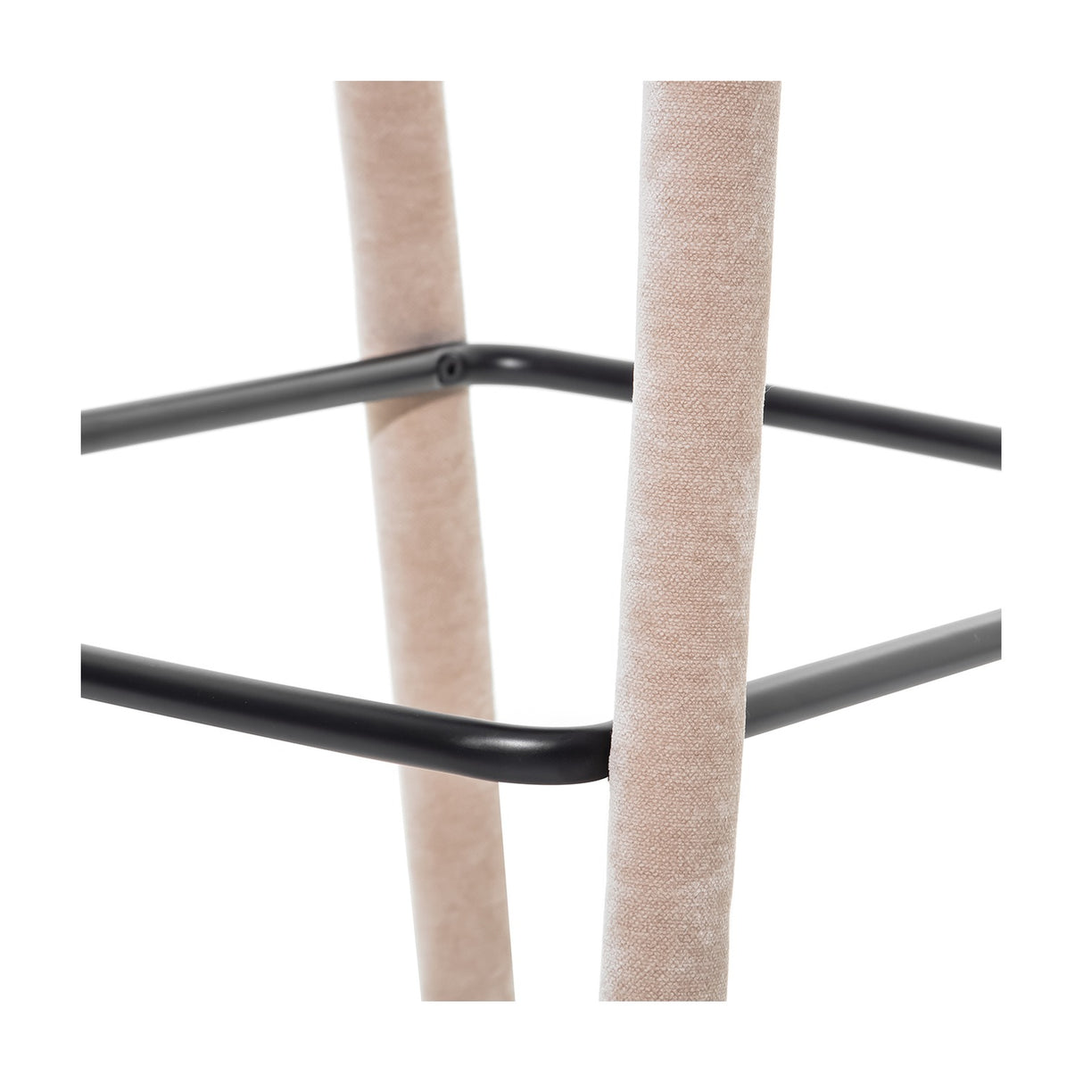 Close-up of Libra Interiors Velvet Wrapped Curved Back Bar Stool in taupe, showing fabric-covered legs meeting the black powder coated metal footrest.