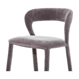 Libra Interiors Velvet Curved-Back Bar Stool in grey with a low curved backrest, padded seat and fabric-wrapped slender legs, shown on a white background.