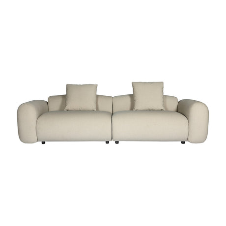 Libra Interiors Brushed Velvet 3 Seater Modular Sofa in cream with rounded arms, two-part build and two matching cushions on a plain white background.