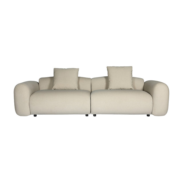 Libra Interiors Brushed Velvet 3 Seater Modular Sofa in cream with rounded arms, two-part build and two matching cushions on a plain white background.