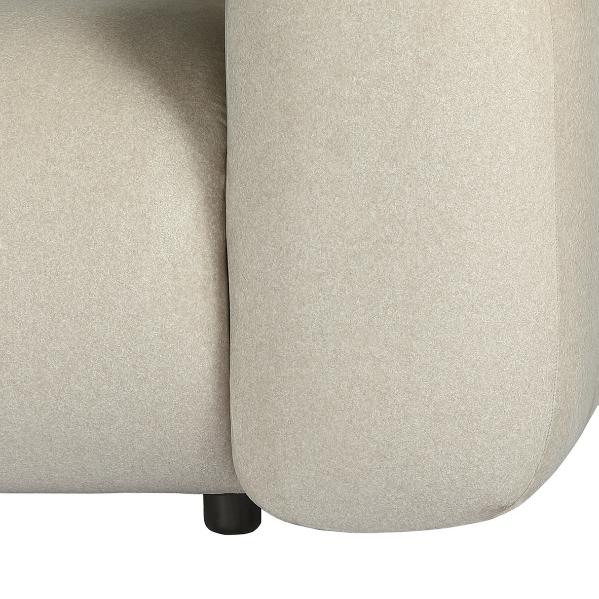 Close-up of the Libra Interiors Brushed Velvet 3 Seater Modular Sofa in cream, showing rounded arm, felted fabric texture and small black cylindrical foot.