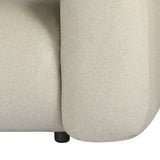 Close-up of the Libra Interiors Brushed Velvet 3 Seater Modular Sofa in cream, showing rounded arm, felted fabric texture and small black cylindrical foot.