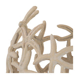 Close-up of Libra Interiors Openwork Starfish Aluminium Decorative Bowl in beige, showing the pierced cluster of starfish motifs and matt stonewash finish.