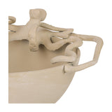 Close-up of Libra Interiors Octopus Stonewash Decorative Bowl in beige aluminium, showing sculpted tentacles curling over the rim in matt stonewash finish.