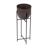 Libra Interiors Hammered Aluminium Raised Planter in brown, with a rounded stonewash pot set within a tall black iron four-leg stand, on a white background.