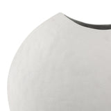 Close-up of the Libra Interiors Hammered White Stonewash Moon Vase showing its matt hammered aluminium surface, pinched neck and dark grey interior opening.