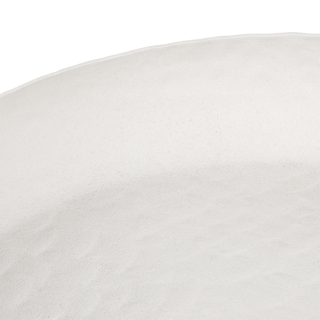 Close-up of the Libra Interiors Stonewash Hammered Round Bowl in white, showing its matt aluminium surface with subtle hammered texture and undulating rim.