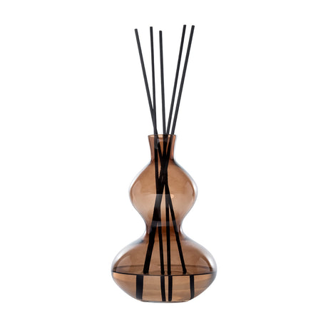 Libra Interiors Sculptural Glass Reed Diffuser in warm brown, curved double-gourd vessel with black reeds, shown against a plain white background.