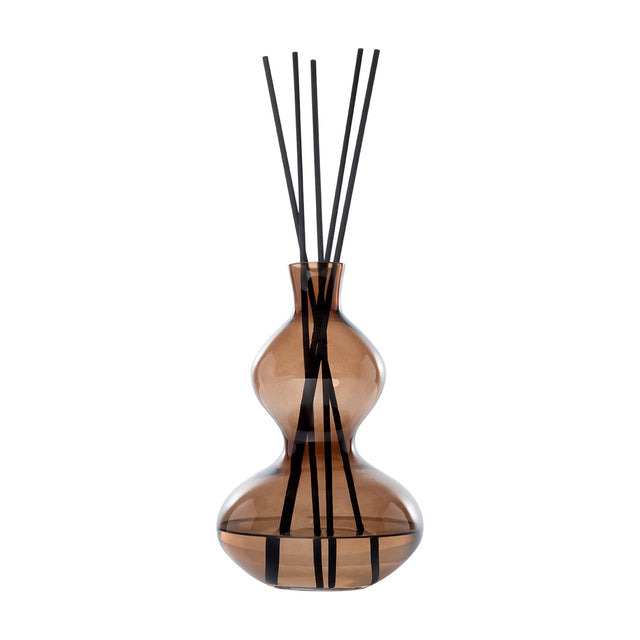Libra Interiors Sculptural Glass Reed Diffuser in warm brown, curved double-gourd vessel with black reeds, shown against a plain white background.
