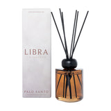 Libra Interiors Palo Santo 200ml reed diffuser in amber glass with black collar and fibre reeds, shown beside its white box on a plain background.