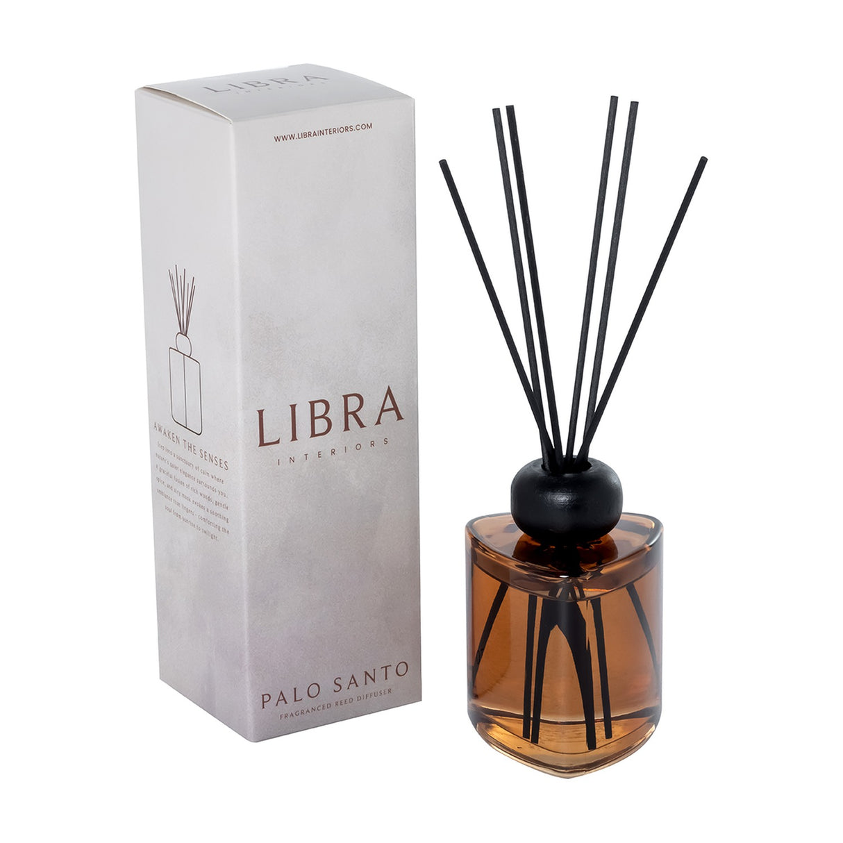 Libra Interiors Palo Santo 200ml reed diffuser in amber glass with a rounded black collar and black fibre reeds, shown beside its grey box.
