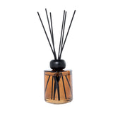 Libra Interiors Amber Glass 200ml Reed Diffuser in brown with black striped detail, rounded black collar and slim black fibre reeds on a white background.