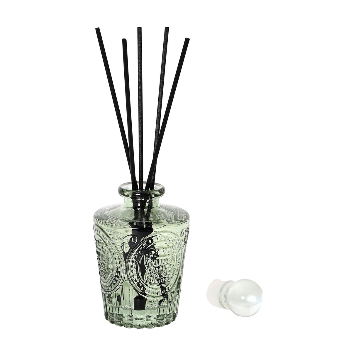 Libra Interiors Embossed Glass Reed Diffuser in soft green tinted glass with black reeds and a spherical glass stopper set beside it on a white background.