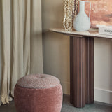 Libra Interiors Velvet Boucle Storage Stool in terracotta with boucle top beside a fluted wood console table, textured vase and linen curtain.