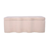 Libra Interiors Velvet Lift-Top Storage Ottoman in cream with a softly curved sculpted base and padded hinged top, shown on a plain white background.