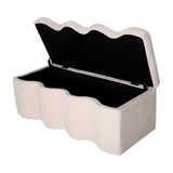 Libra Interiors Velvet Lift-Top Storage Ottoman in cream with a scalloped wavy profile, lid raised to show the black-lined interior storage compartment.