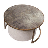 Libra Interiors Round Map-Print Glass Nesting Coffee Table with brass-toned iron frame and neutral cobble-weave fabric pouffe tucked beneath.