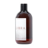 Libra Interiors Palo Santo 500ml reed diffuser refill in an amber-brown glass bottle with black screw cap and white front label, on a plain white background.