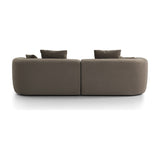 Rear view of Libra Interiors Velvet Curved 2-Seater Modular Sofa in truffle, showing rounded two-section form and scatter cushions on white.