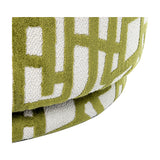 Close-up of the Libra Interiors Bouclé Swivel Accent Piece in ivory with a raised olive green abstract pattern on the textured cushioned seat and base.