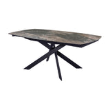 Libra Interiors extendable dining table with smoked grey ceramic stone-effect top and matt black angular intersecting metal legs, on white background.