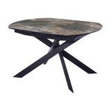Libra Interiors extendable dining table with smoked grey ceramic stone-effect top and matt black angular intersecting metal legs on a white background.
