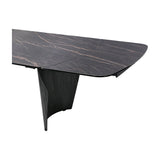 Libra Interiors extendable dining table with charcoal ceramic stone-effect top, bronze veining and curved dark wood-effect pedestal base, on white.