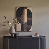 Libra Interiors Ceramic Top Curved Sideboard in charcoal styled with a ceramic vase, dried leaves and geometric artwork against a warm neutral wall.