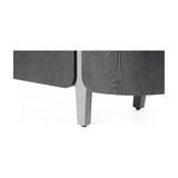 Close-up of Libra Interiors Ceramic Top Curved Sideboard in charcoal, showing curved dark oak veneer panels and tapered light grey legs.