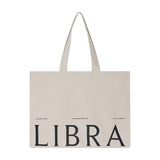 Libra Interiors natural cotton tote bag with long shoulder handles and black LIBRA lettering printed across the front, shown on a plain white background.