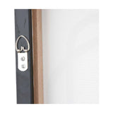 Close-up of a black canvas wall art frame's mounted D-ring hook and screws on the rear, showing wood frame edge and white canvas fabric.