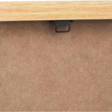 Close-up of the canvas wall art's reverse side, showing a natural wood frame edge, black sawtooth hanger, and MDF backing board.