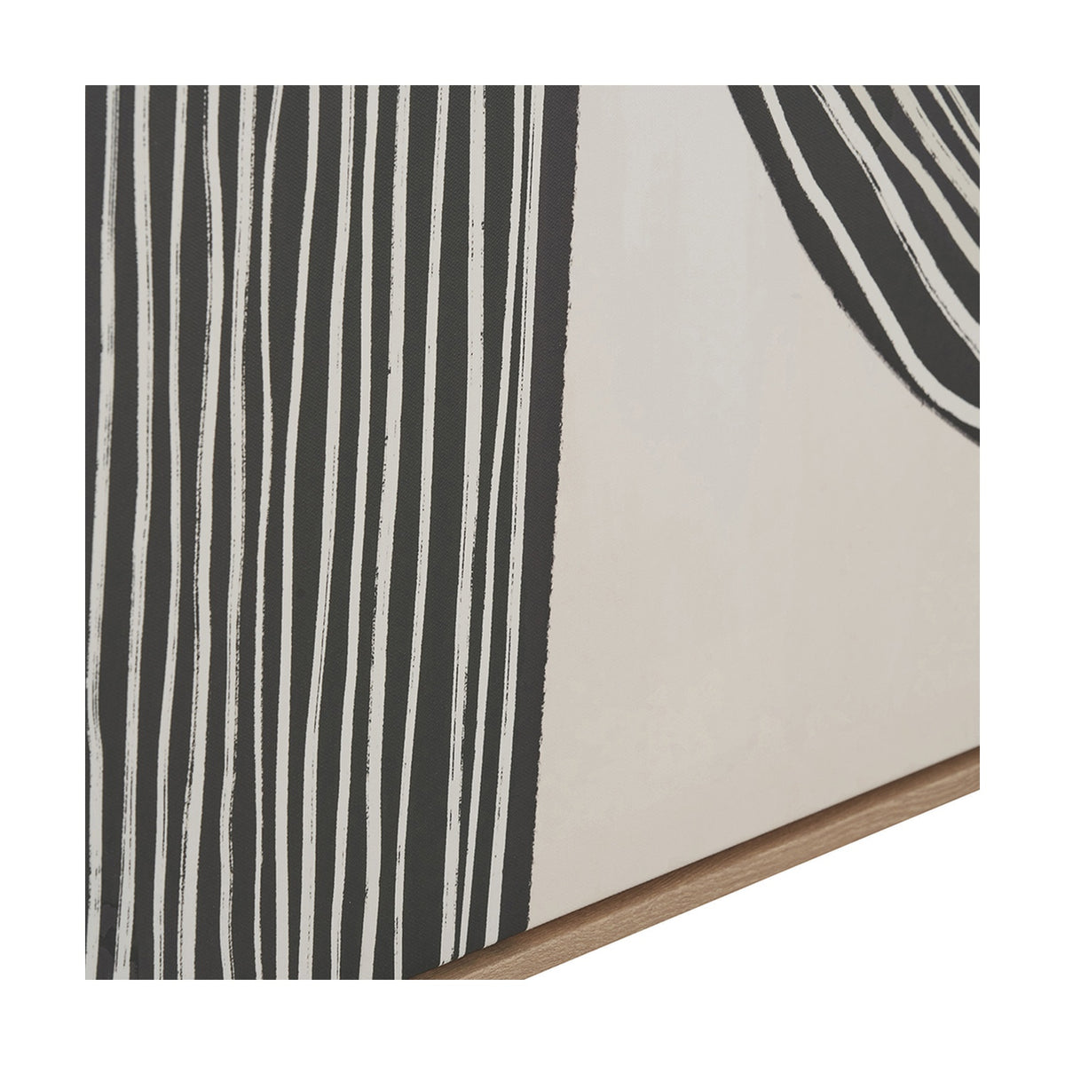 Corner detail of the Black & Beige Abstract Canvas showing bold black and white vertical stripes, a beige panel, and the natural wood frame edge.