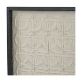 Close-up of natural paper wall art in a black wood frame, showing a raised grid pattern of textured cream fibre squares.