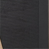 Close-up of black wall art from the Set of 2 Black & Natural Wooden Textured Design Wall Art, showing fine horizontal grooved wood texture with a natural wood edge visible at the side.