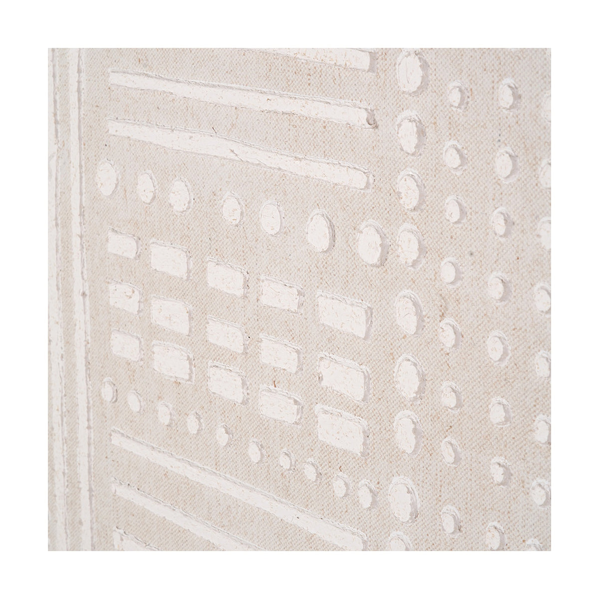 Close-up of a textured white and natural linen canvas wall art, showing raised geometric rows of dots, dashes, and rectangles in a natural weave finish.