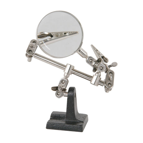 Mercury MAG01 Helping Hands Magnifier Stand with two crocodile clips, 60mm glass lens on jointed metal arms, and black cast base on a white background.