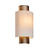 Endon Brenwood wall light with hammered aged bronze fitting and natural linen-effect fabric shade, shown illuminated on a plain white background.