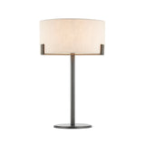 Brendon Table Lamp in bronze finish with a natural linen drum shade on a slim metal stem and round base, shown on a plain white background.