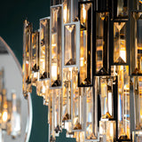 Close-up of the Endon Danedale 12 light chandelier showing tiered champagne bevelled crystals set in a polished chrome frame with warm illumination.
