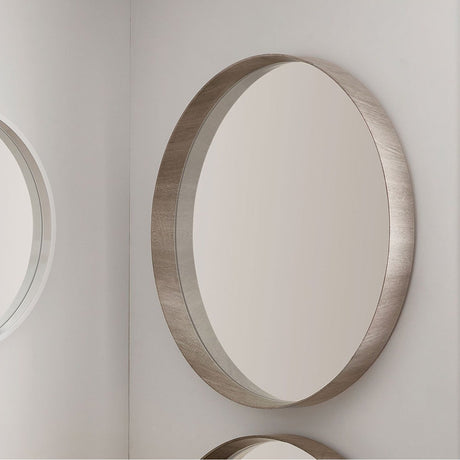 Round wall mirror with a deep grey oak wood veneer frame, 74 x 74cm, mounted on a light grey wall alongside other round mirrors.